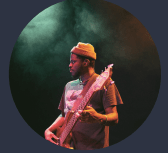 Photo of instructor Imari Mubarak playing the bass